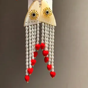 Vintage resin pearl tassel earrings featuring red heart charms and 925 silver needles