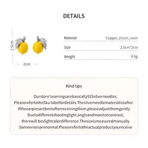 Detailed view of micro-set zircon lemon earrings with copper and resin materials