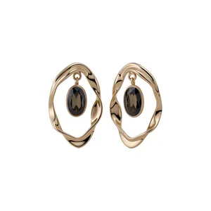 Vintage style gold wrinkled hoop earrings with oval brown gemstone center