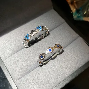 Elegant silver-tone heart-shaped open ring set with sparkling blue zircon in a gift box