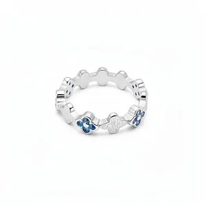 Elegant silver ring featuring a unique blue zircon floral pattern on a minimalist metal band.
