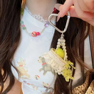 Detailed view of handmade beaded pearl necklace and apple basket pendant set for women.