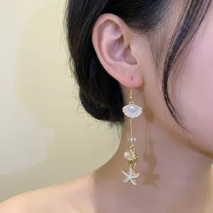 Elegant seaside vacation drop earrings featuring shell, starfish and pearl details