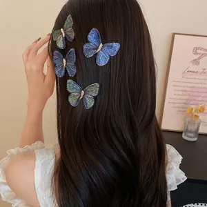 Detail of knitted butterfly hair clips on long hair for a retro sweet look.