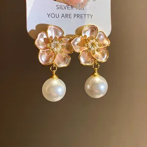 Elegant pink enamel flower drop earrings with white pearls and sparkling zircon accents