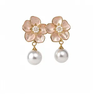 Elegant flower pearl drop earrings with pink enamel and zircon center in gold finish