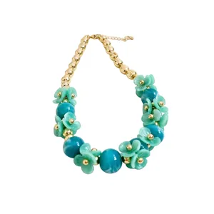 Teal acrylic flower beaded necklace with gold accents, holiday style jewelry for women