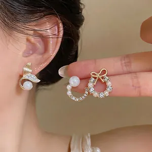 Elegant mermaid tail and bow wreath pearl earring set decorated with sparkling rhinestones