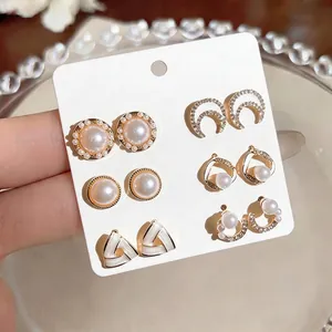 Elegant 6-pair pearl and rhinestone stud earring set displayed on a white jewelry card