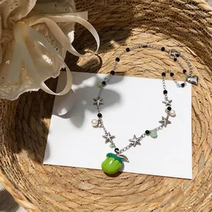 Fresh beaded necklace with green apple pendant, star charms and elegant pearls!