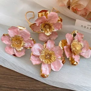 Vintage romantic pink enamel flower stud earrings with elegant gold metal centers