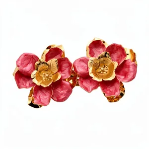 Vintage palace style metal enamel flower stud earrings with pink petals and gold accents.