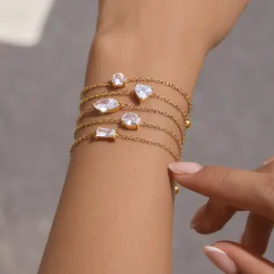 Set of adjustable 18K gold plated bracelets with various CZ shapes on model wrist