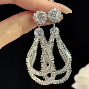 Close-up of elegant vintage waterdrop earrings with intricate zircon wrap design