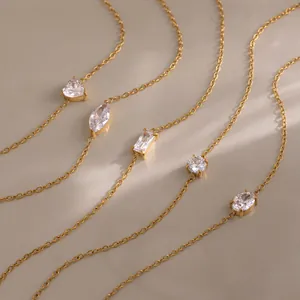 Detail of various zircon shapes on gold plated stainless steel chain bracelets.