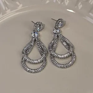 Detail showing the intricate zircon work on these vintage-style silver drop earrings