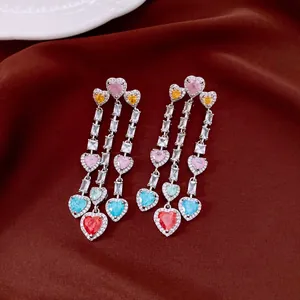 Exquisite detail of vintage silver tassel earrings featuring colorful heart-shaped zircons