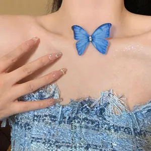 Close-up of elegant blue snow yarn butterfly necklace with sparkling rhinestones