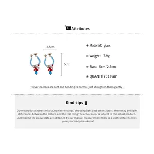 Detailed specifications of retro red mushroom glass earrings with blue bead accents