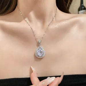 Elegant teardrop pendant necklace with a large zircon stone worn by a model.