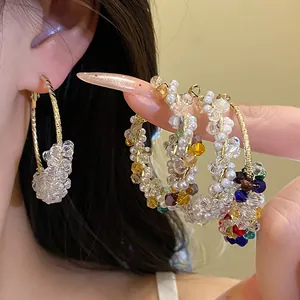 Dopamine style colorful beaded hoop earrings featuring vibrant crystals and pearls.