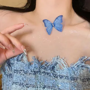 Exquisite close-up of blue snow yarn butterfly choker with elegant rhinestone center detail
