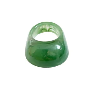Stylish green marbled resin ring with a minimalist design for a modern luxury look.