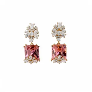 Vintage gold-toned earrings with square pink stones and floral zirconia accents.