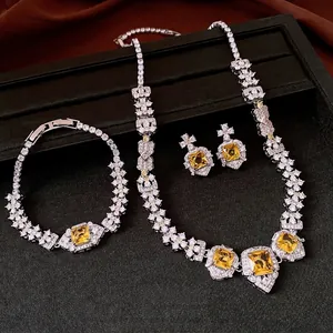 Vintage luxury jewelry set with square yellow zircons, including necklace, bracelet and earrings