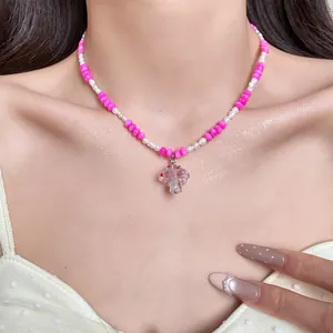 Detailed shot of a pink and white freshwater pearl necklace with a heart pendant