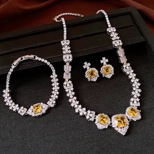 Detailed macro shot of vintage zircon jewelry set featuring yellow square gemstones in silver.