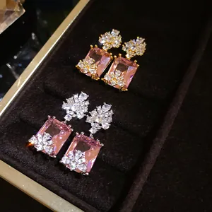 Macro view of vintage palace style pink zircon square drop earrings in jewelry box