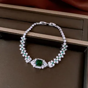 Detailed view of vintage court style bracelet with square green zircon in brown box