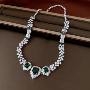 Close-up of royal style necklace with emerald-colored square zircon stones