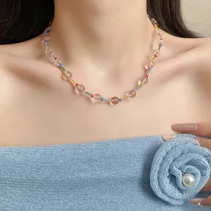 Close-up of a resort style colorful beaded necklace with transparent and candy color beads