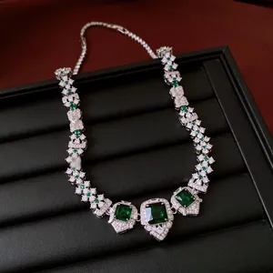Detailed close-up of a vintage court style necklace with green square zircon pendants