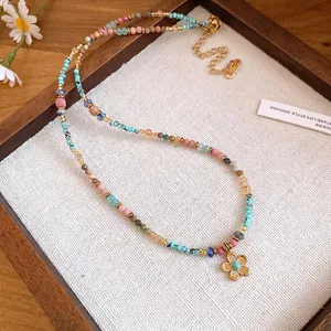 Bohemian colorful dopamine beaded necklace featuring a gold flower pendant on stainless steel