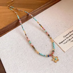 Bohemian colorful beaded necklace with a delicate gold flower pendant jewelry gift