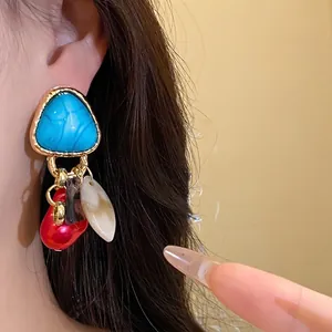 Pendientes de borla triangulares vintage con piedra azul y detalles de nácar