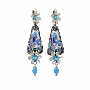 Vintage floral resin drop earrings with blue rhinestones and elegant gold-tone finish