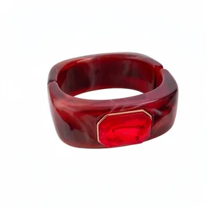 Vintage red marble resin square bangle featuring a large faceted ruby-red gemstone centerpiece