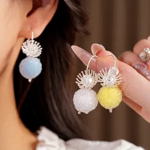 Elegant minimalist glass flower beaded hook earrings in pastel blue, white and yellow tones