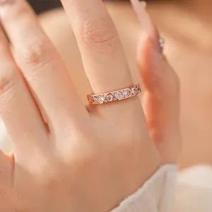 Rose gold geometric triangle ring featuring sparkling cubic zircon stones for women.
