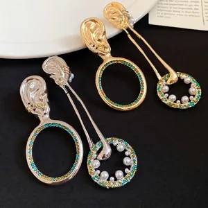 Orecchini retrò in argento con pendenti circolari in strass, finiture oro e argento