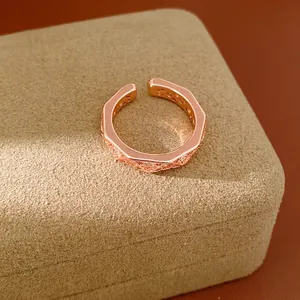 Elegant rose gold geometric faceted open ring featuring sparkling cubic zirconia stones inlay