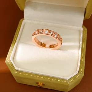 Macro view of geometric triangular faceted ring with sparkling cubic zirconia in rose gold