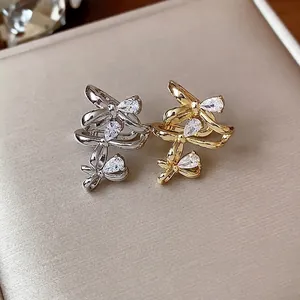 Elegant 18k gold plated bow-knot ear cuffs set with sparkling pear-shaped zircons