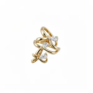 Elegant 18k gold plated ear cuff with bow design and sparkling teardrop zircons detail.