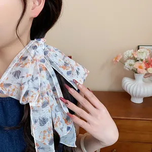 Elegant floral chiffon scarf necklace close-up showing the delicate fabric texture
