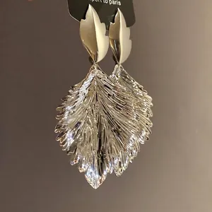 Stylish silver-tone leaf drop earrings with metallic crinkle texture and elegant design